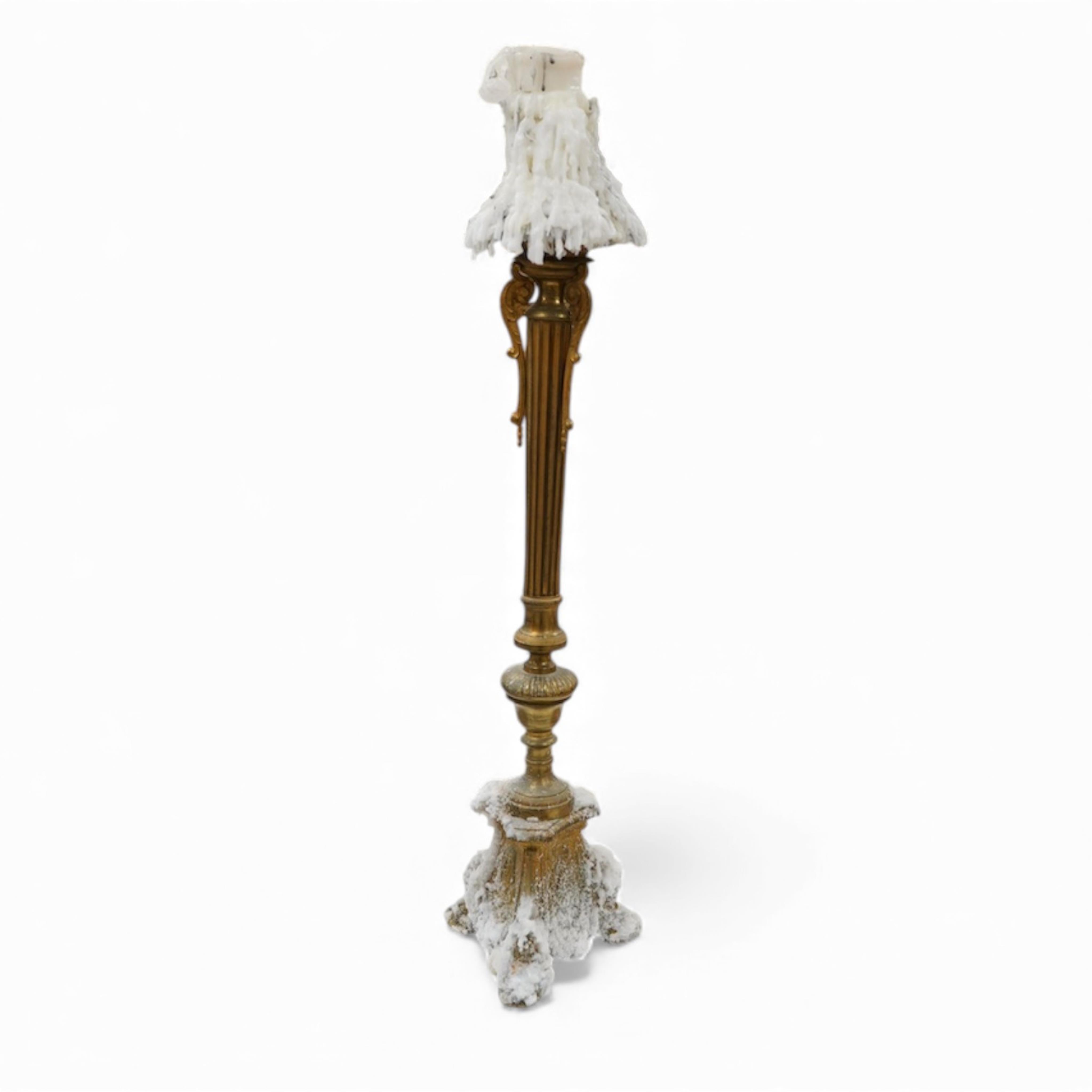 A brass column candlestick, 73cm